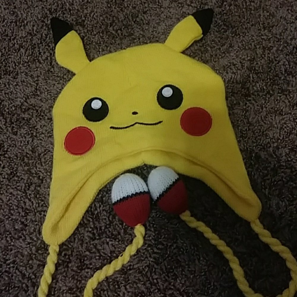 pokemon hat, cat stuffed animals, fox pillow